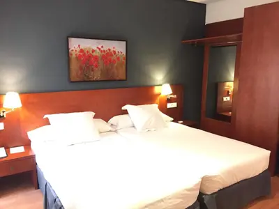 Cama o camas de una habitación en TRH Ciudad de Baeza
