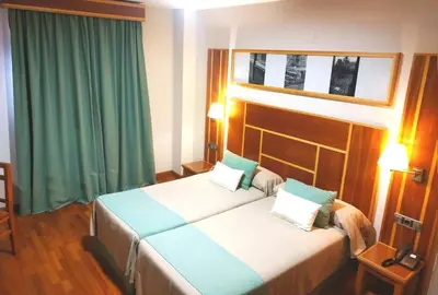 Cama o camas de una habitación en Hotel Carmen