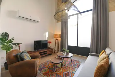 Una televisión o centro de entretenimiento en RentalSevilla San Esteban