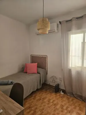 Cama o camas de una habitación en Vivienda con fines turísticos ALMA
