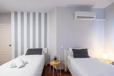 Cama o camas de una habitación en Apartamento New Folch Sevilla A