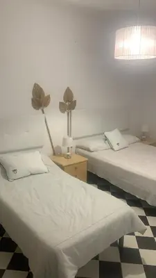 Cama o camas de una habitación en ALOJAMIENTO RURAL CASA LOS ARENALES