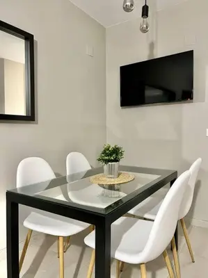 Una televisión o centro de entretenimiento en NEW! Alojamiento - Los Patios de la Ribera