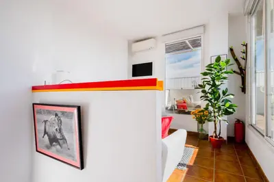 Una televisión o centro de entretenimiento en Beautiful Penthouse with terrace - San Luis - 2Bdr
