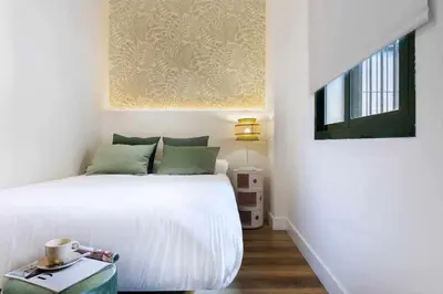 Cama o camas de una habitación en MonKeys Apartments San Román Deluxe