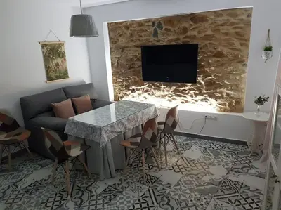 Una televisión o centro de entretenimiento en Casa Rural Los Naranjos