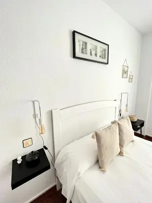 Cama o camas de una habitación en APARTAMENTO VERA, Apartamento de 2 dormitorios con balcón en el centro de Antequera
