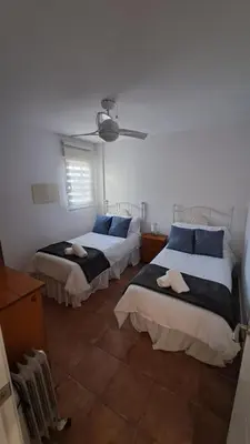 Cama o camas de una habitación en El Madroño de la Encantada