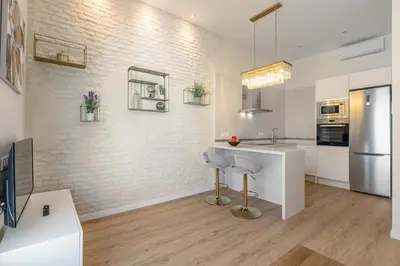 Una cocina o zona de cocina en La Joya de Santa Cruz Calle Vírgenes 21