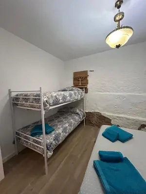 Cama o camas de una habitación en Almodovar alojamientos 1