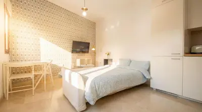 Cama o camas de una habitación en Charming apt in the center - 10m walk Isla Mágica