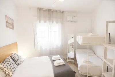 Cama o camas de una habitación en RentalSevilla Plaza de Pilatos