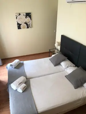 Cama o camas de una habitación en Hospedería Luis de Góngora