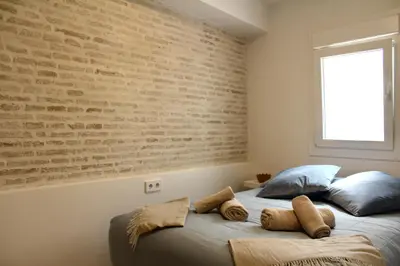 Cama o camas de una habitación en WISH SUITE SAN BARTOLOME DE SEVILLA