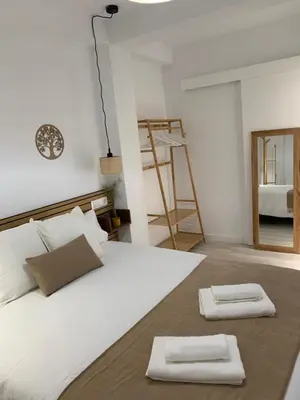 Cama o camas de una habitación en APARTAMENTO MEDINA AZAHARA