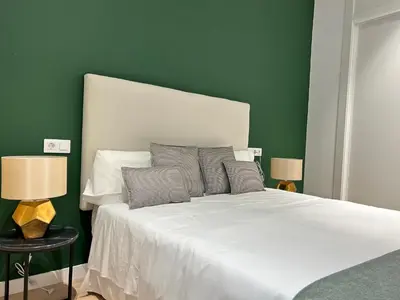Cama o camas de una habitación en HISPALIS SETAS DE SEVILLA