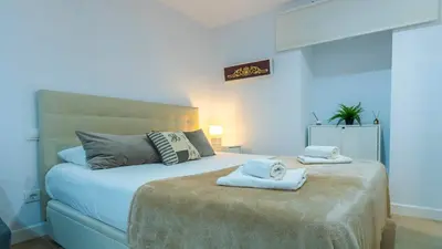 Cama o camas de una habitación en Natural Suite Sevilla Center