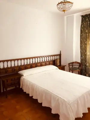 Cama o camas de una habitación en Vivienda Familiar en el Centro de Baeza