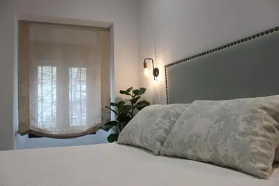 Cama o camas de una habitación en SUITE DEL CASTILLO