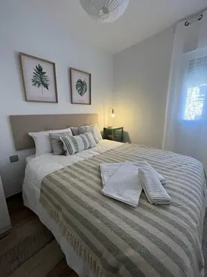 Cama o camas de una habitación en Apartamento ciudad jardín cuarta planta sin ascensor