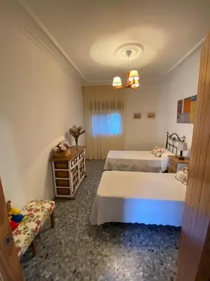 Cama o camas de una habitación en CHALET con ENCANTO en SIERRA CORDOBESA. WIFI