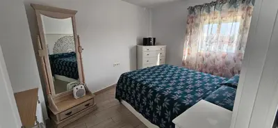 Cama o camas de una habitación en Piso luminoso y acogedor