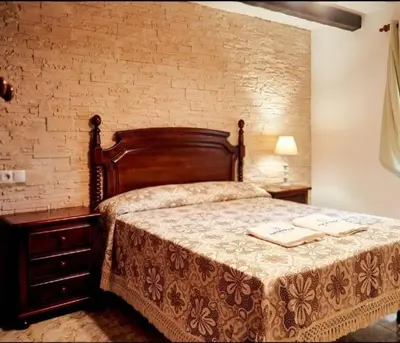 Cama o camas de una habitación en Casa rural El Parral