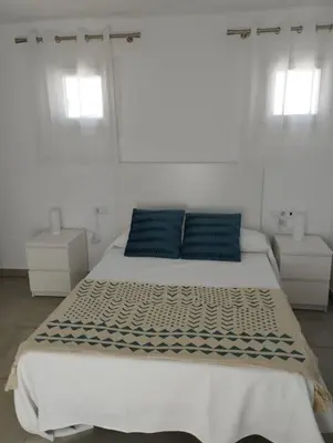 Cama o camas de una habitación en APARTAMENTOS TRES SOLES