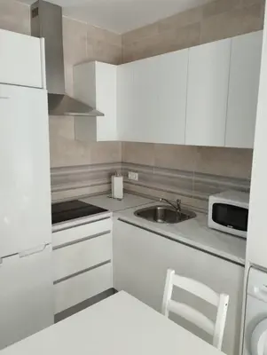 Una cocina o zona de cocina en APARTAMENTOS TRES SOLES