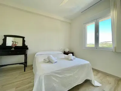 Cama o camas de una habitación en Geysotur Casa de la Abuela Antonia