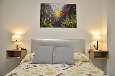 Cama o camas de una habitación en Loft Dos Lunas, cerca del centro