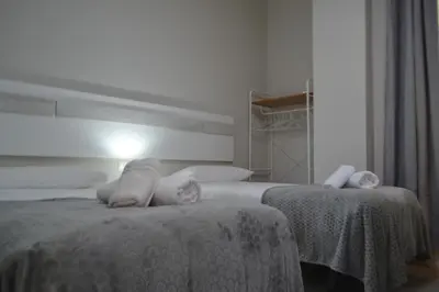 Cama o camas de una habitación en SunShine Capricho de las Tendillas