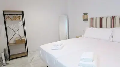 Cama o camas de una habitación en Casa en el Centro de Sevilla