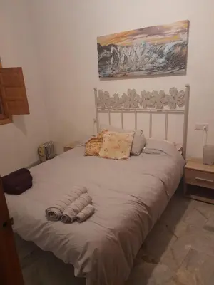 Cama o camas de una habitación en Vivienda típica cordobesa en LEIVA AGUILAR