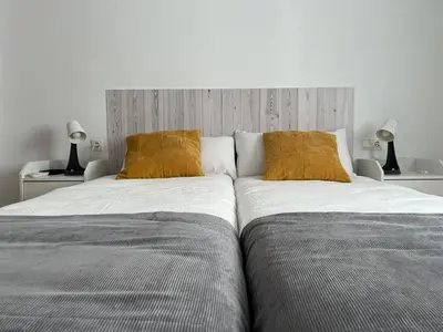 Cama o camas de una habitación en Apartamento San Agustín Nº 1