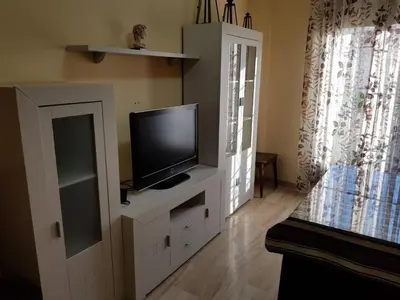 Una televisión o centro de entretenimiento en Apartamento Duplex El Porche