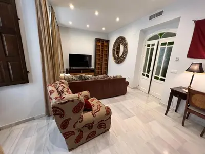 Una televisión o centro de entretenimiento en Apartment Palacio de Los Vibora Parking Gratis