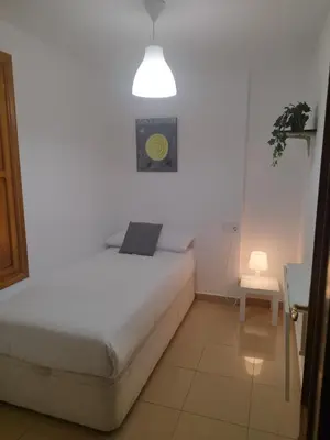 Cama o camas de una habitación en RINCÓN MURALLA DE LA MACARENA