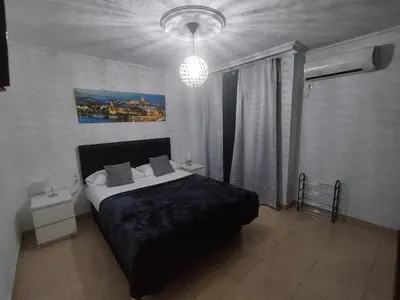 Cama o camas de una habitación en RINCÓN MURALLA DE LA MACARENA