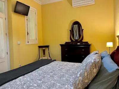 Cama o camas de una habitación en Apartamento Suite Alameda de Hercules