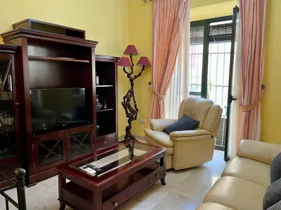 Una televisión o centro de entretenimiento en Apartamento Suite Alameda de Hercules