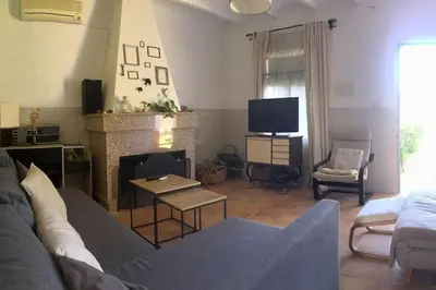 Una televisión o centro de entretenimiento en Casa La Soleá Cerro Muriano