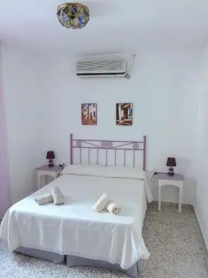 Cama o camas de una habitación en Tu casa en Córdoba fácil aparcamiento
