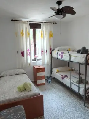 Cama o camas de una habitación en Tu casa en Córdoba fácil aparcamiento