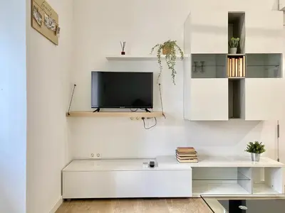 Una televisión o centro de entretenimiento en Apartamento Villa María II