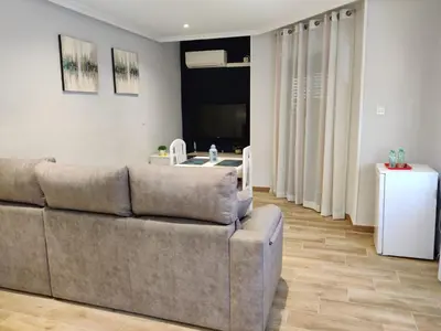 Zona de estar de Duerme a gusto - Tu habitación acogedora en Torredonjimeno