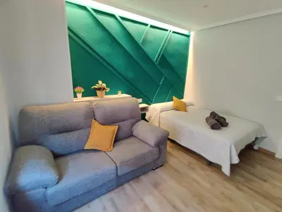 Zona de estar de Duerme a gusto - Tu habitación acogedora en Torredonjimeno
