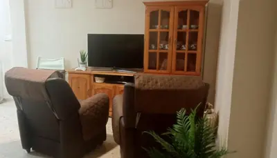 Una televisión o centro de entretenimiento en Apartamento La Viñuela