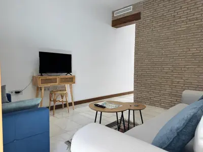 Una televisión o centro de entretenimiento en La Casa de La Escalera 4