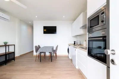 Una cocina o zona de cocina en Apartamentos Cervantes 17